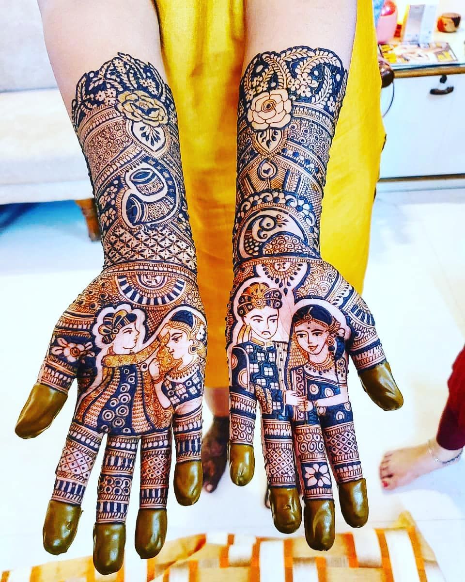 Bride with full bridal mehendi on both palms by bridal mehendi artist in Kolkata