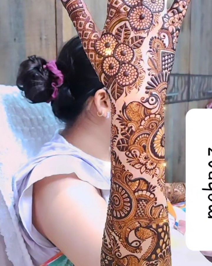 Bridal arm mehendi shown over shoulder