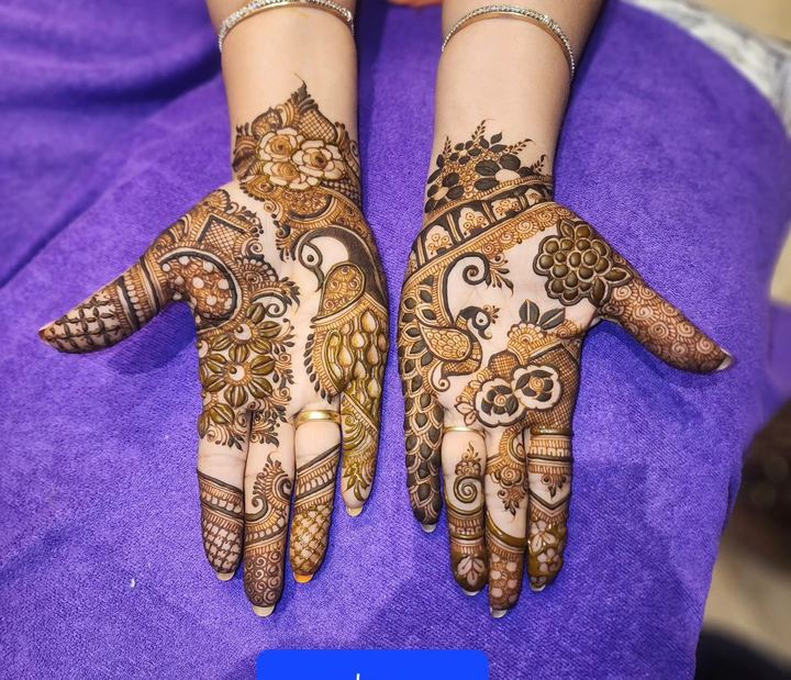 Bridal mehendi palms with dense floral and jaali on purple dupatta