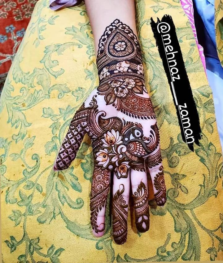 Floral mandala mehendi on palm with paisley flow